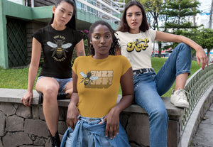 Group of girls wearing shirts with bees on them